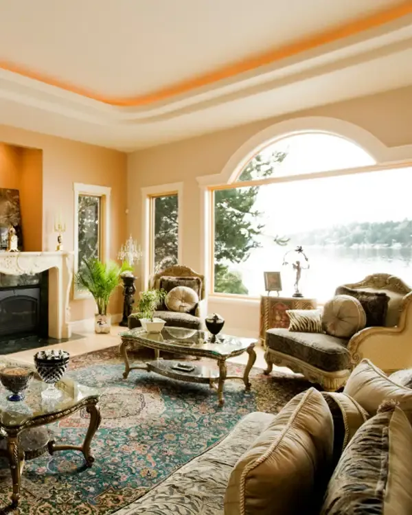 A bright living room with a large arched window, featured in the House and Leisure newsletter